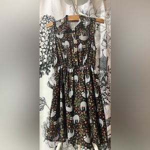 size four knee length dress with floral sloth pattern by paper plane of London.